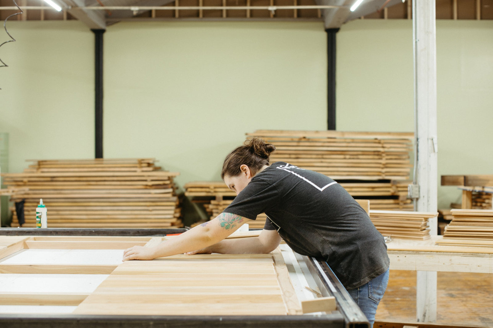 Laying cedar panels onto a wall frame