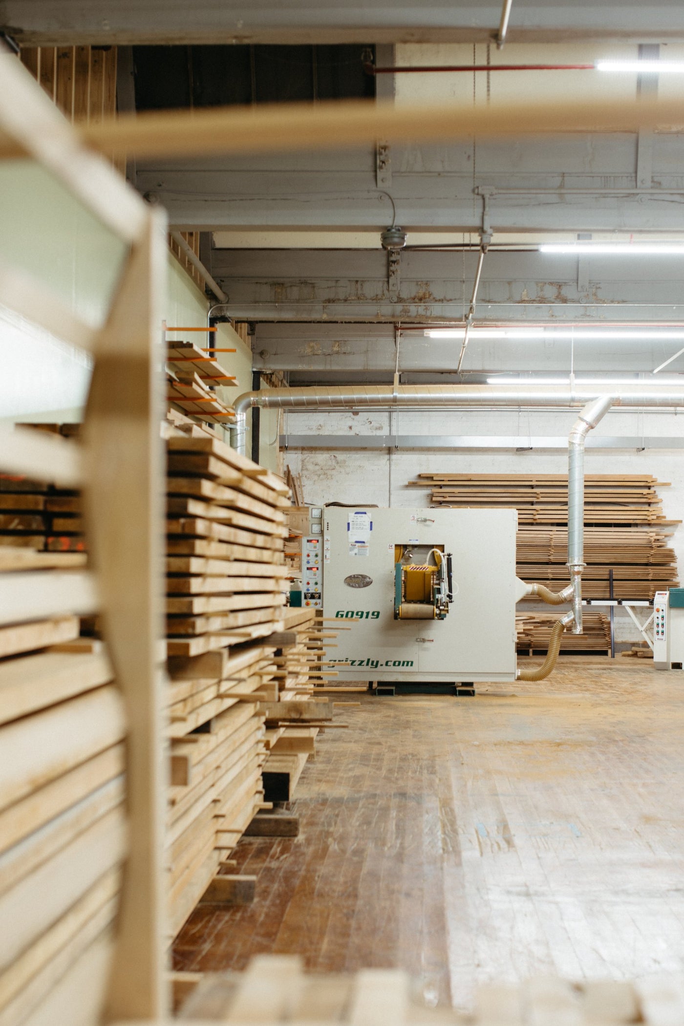 The molder beside stacks of rough cedar