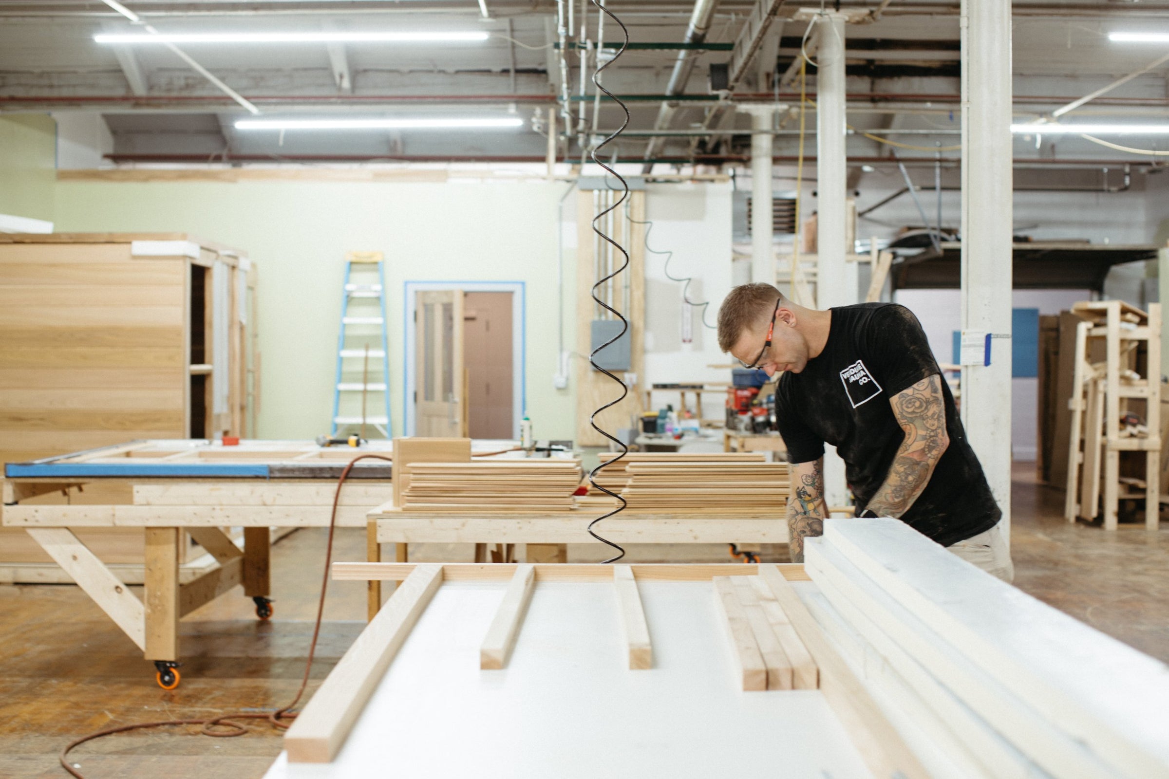 Cutting cedar framing at the bench
