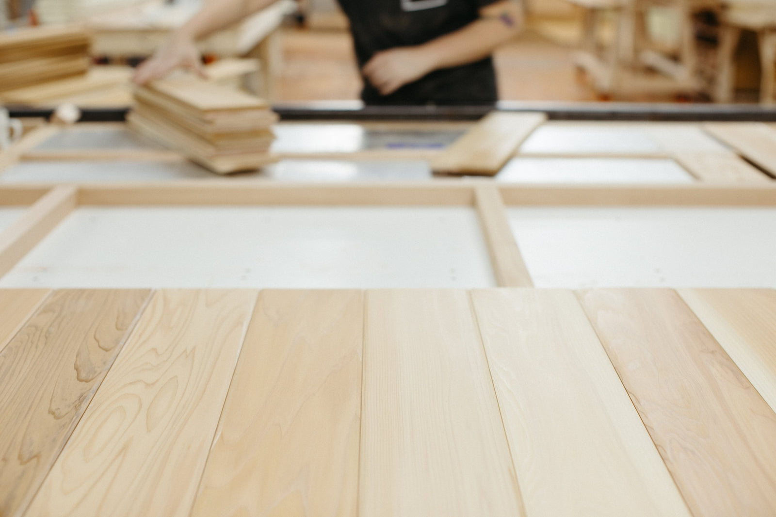 Sanded cedar panels laid out on the bench
