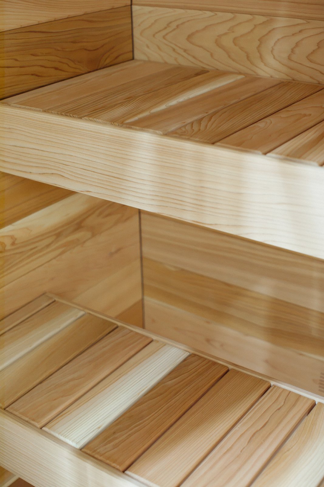 The cedar benches inside a Tiiviis